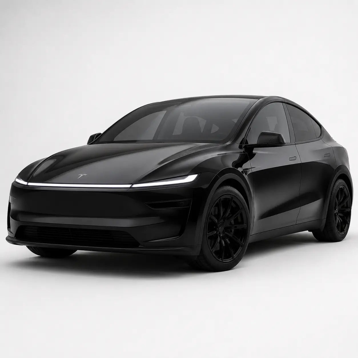 Fekete tesla model y a model y juniper kollekcióból, karbonszálas kipufogó rendszerrel és letisztult designnal hátulról