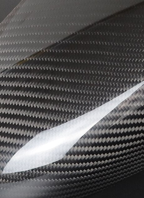 Close-up of the twill weave pattern of the gloss carbon interior trim – BMW F90 M5 and G30 5 Series