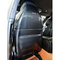 Carbon seat back cover fitted to a BMW F90 M5 front seat, rear view