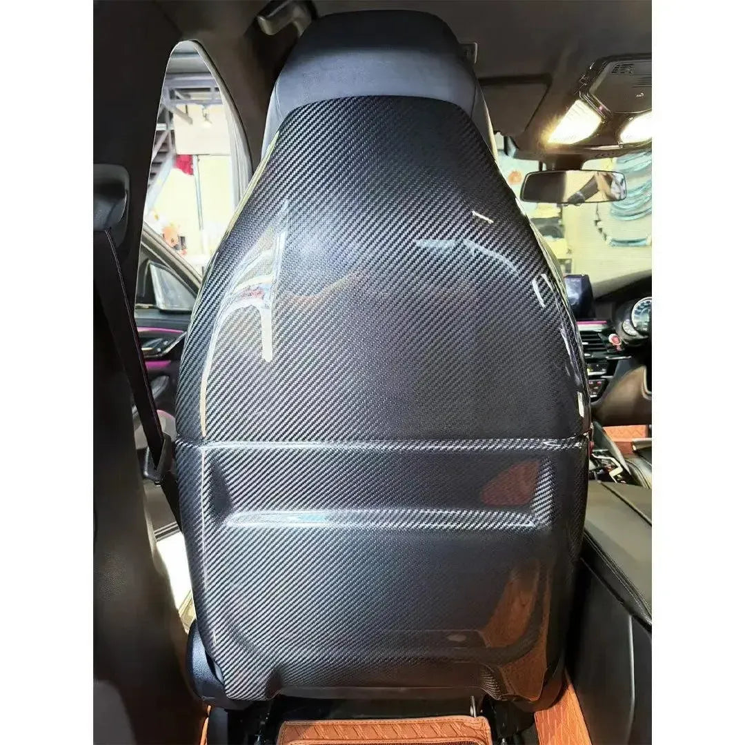 Carbon seat back cover on the front seat, straight from behind – BMW F90 M5