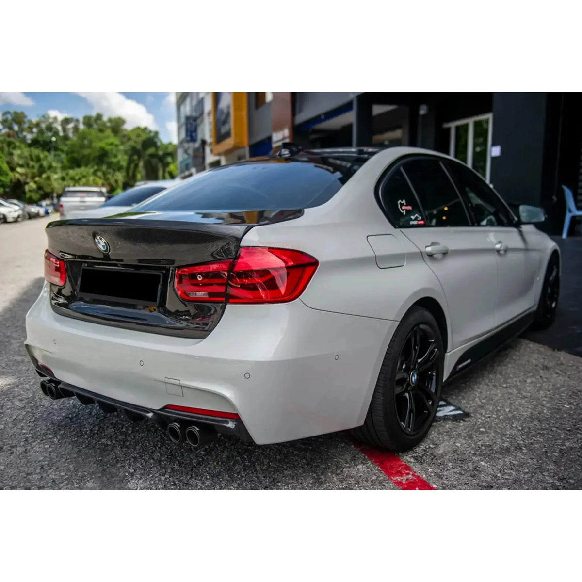 White BMW F30, rear three-quarter view, with carbon trunk lid (MBJ Style)