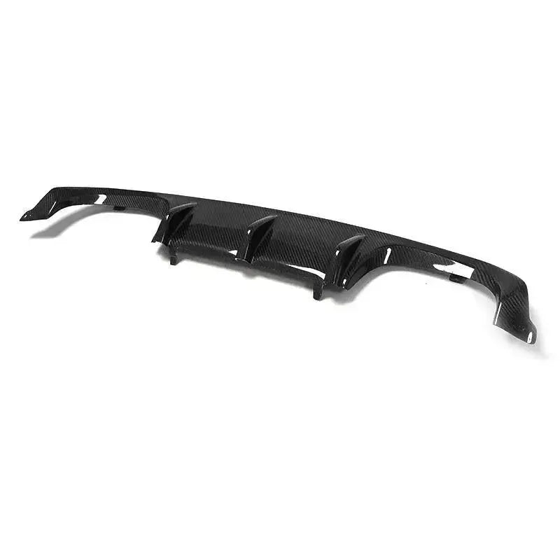 Carbon fiber rear diffuser, angled view, on a white background (MP Style) – BMW F80 M3 / F82 M4