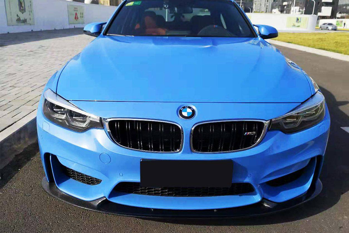 Blue BMW F82 M4 straight head-on, with carbon fiber front lip (D3 Style)