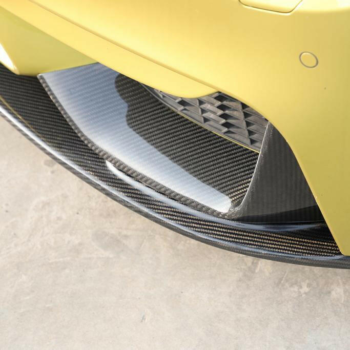 Carbon corner splitter close-up on the corner of a yellow BMW F82 M4 front bumper (Performance Style)