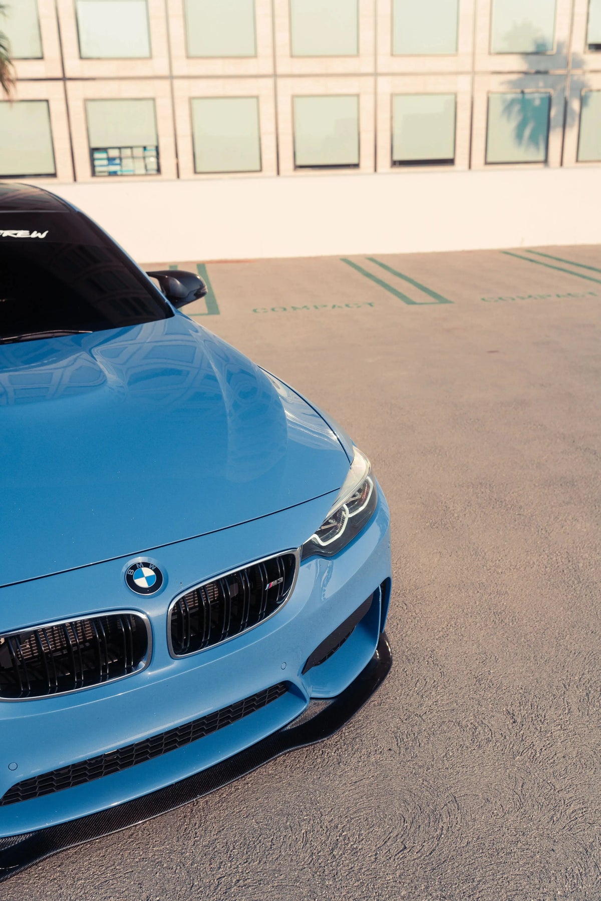Blue BMW F80 M3 front from above, close-up, fitted carbon front lip (PSM Style)