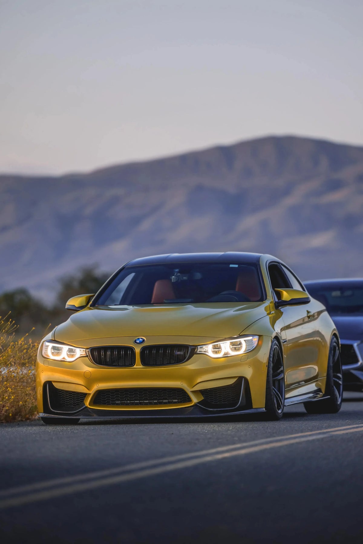 Yellow BMW F82 M4 on the move, closer front view, with carbon lip (RSC Style)