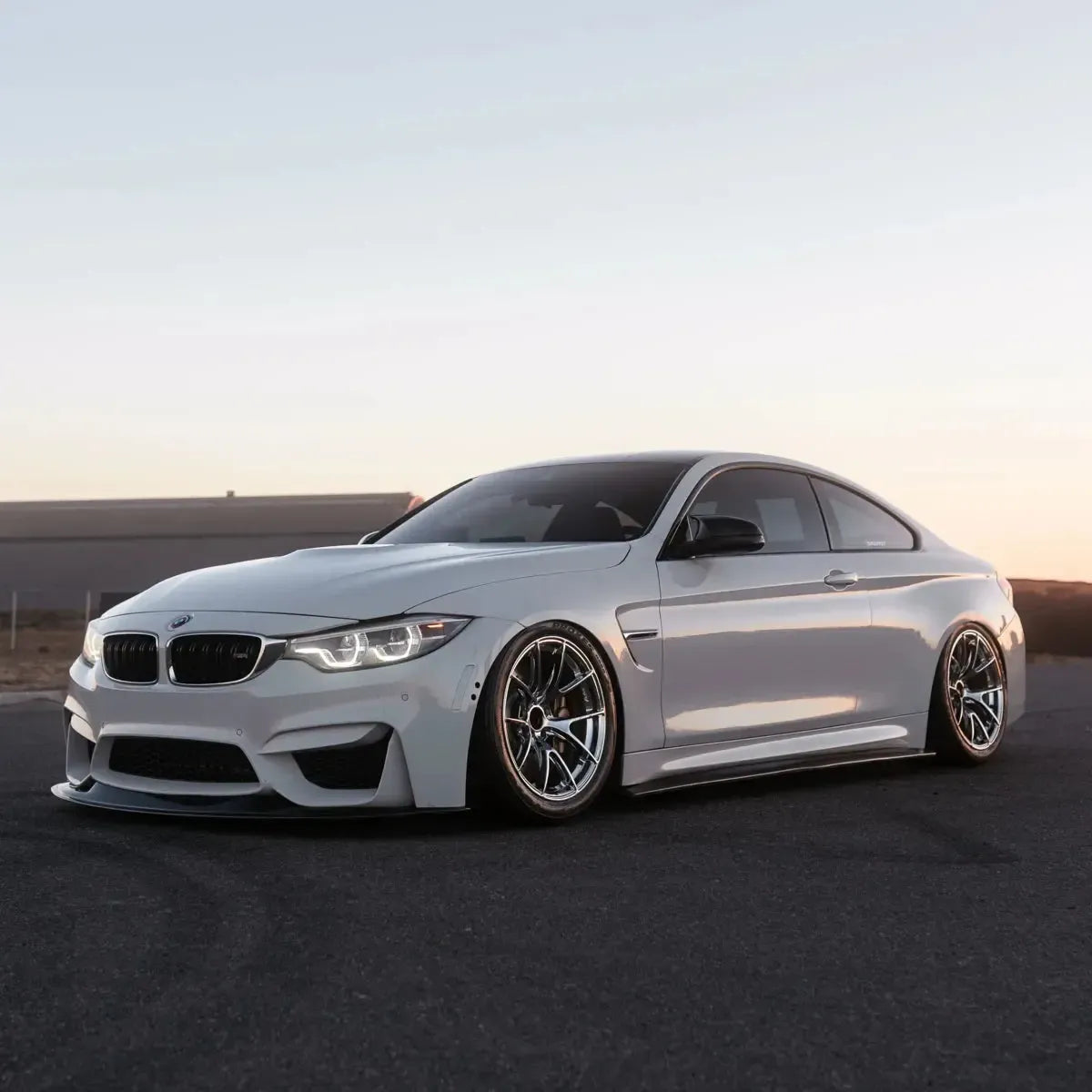 LED headlight with white DRL on a white BMW F82 M4, three-quarter front view (LCI Ikon Style)