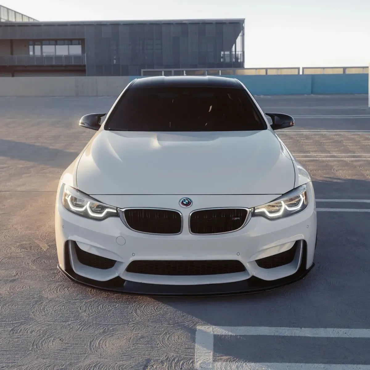 White BMW F82 M4 head-on, full LED headlights with illuminated DRL (LCI Ikon Style)