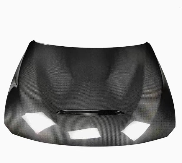Carbon hood on a white background from above, with central heat extraction vent (GTS Style) – BMW F80 M3 / F82 M4