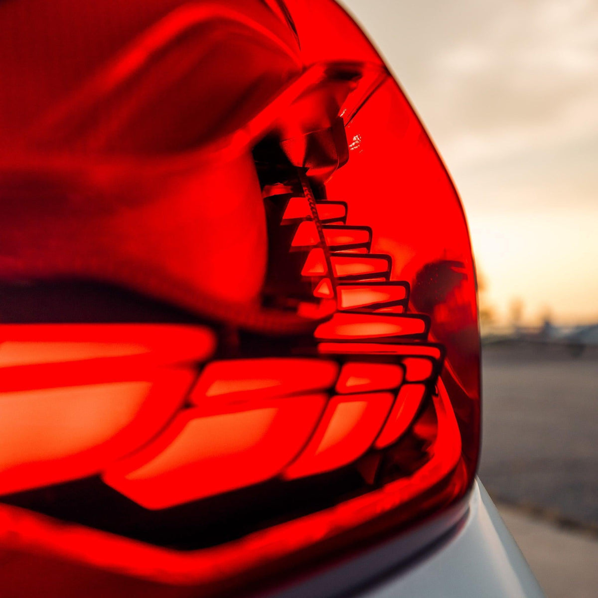Illuminated red OLED tail light close-up, with dragon-scale pattern segments (GTS Style) – BMW F82 M4 / F32