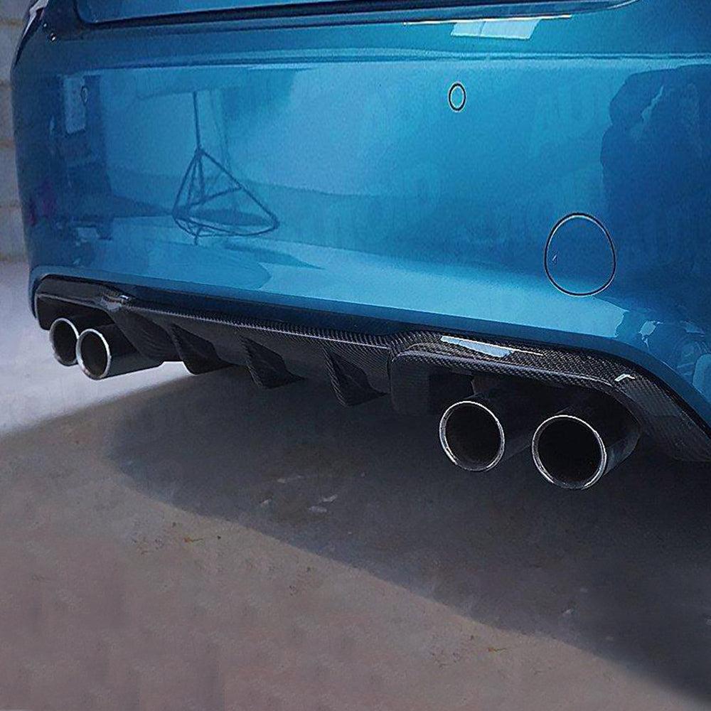 Close-up of a blue BMW F87 M2 rear with four exhaust tips and MP Style carbon diffuser