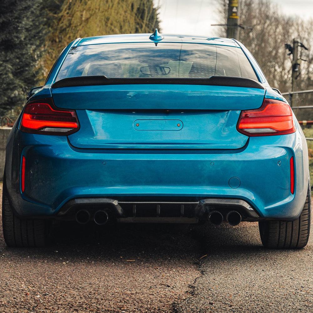 Blue BMW F87 M2 from the rear with fitted MP Style carbon diffuser