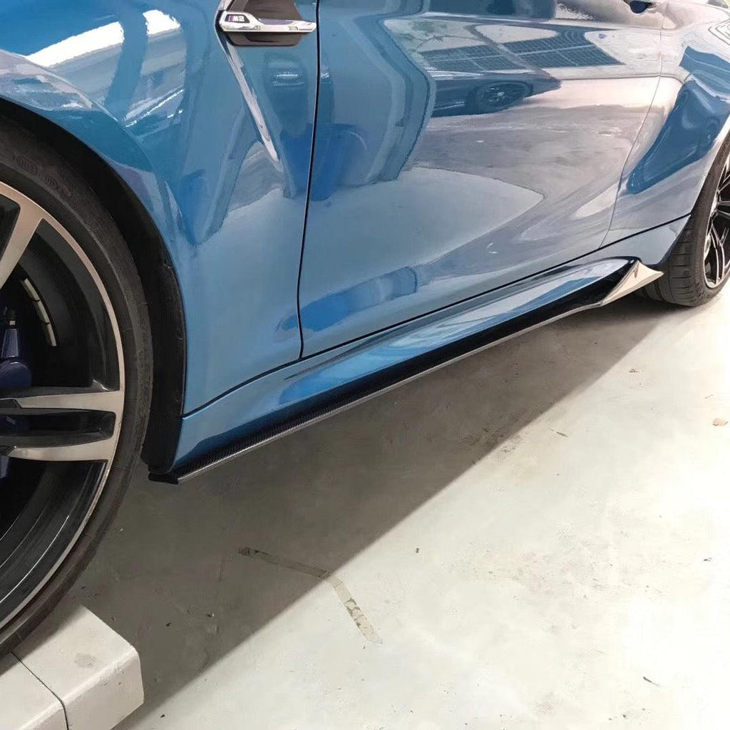 Blue BMW F87 M2 from the side with fitted MTC Style carbon fiber side skirt extensions