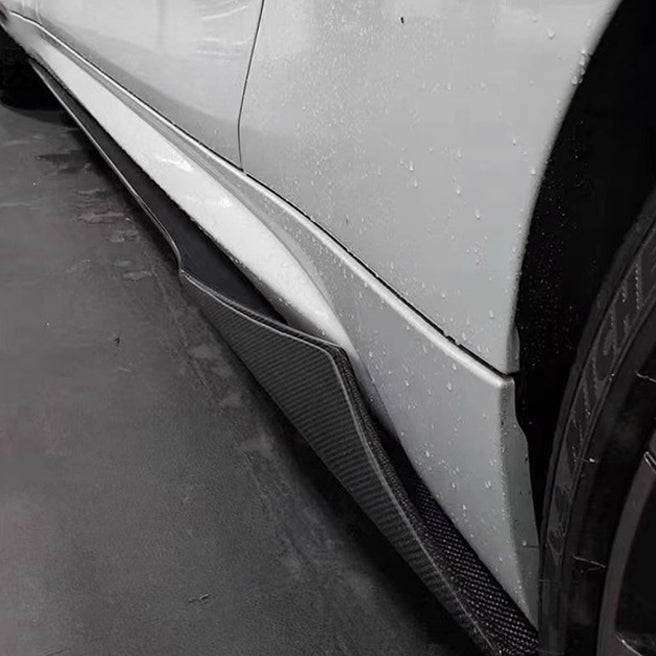 White BMW F87 M2 side sill with MTC Style carbon fiber skirt extension, close-up