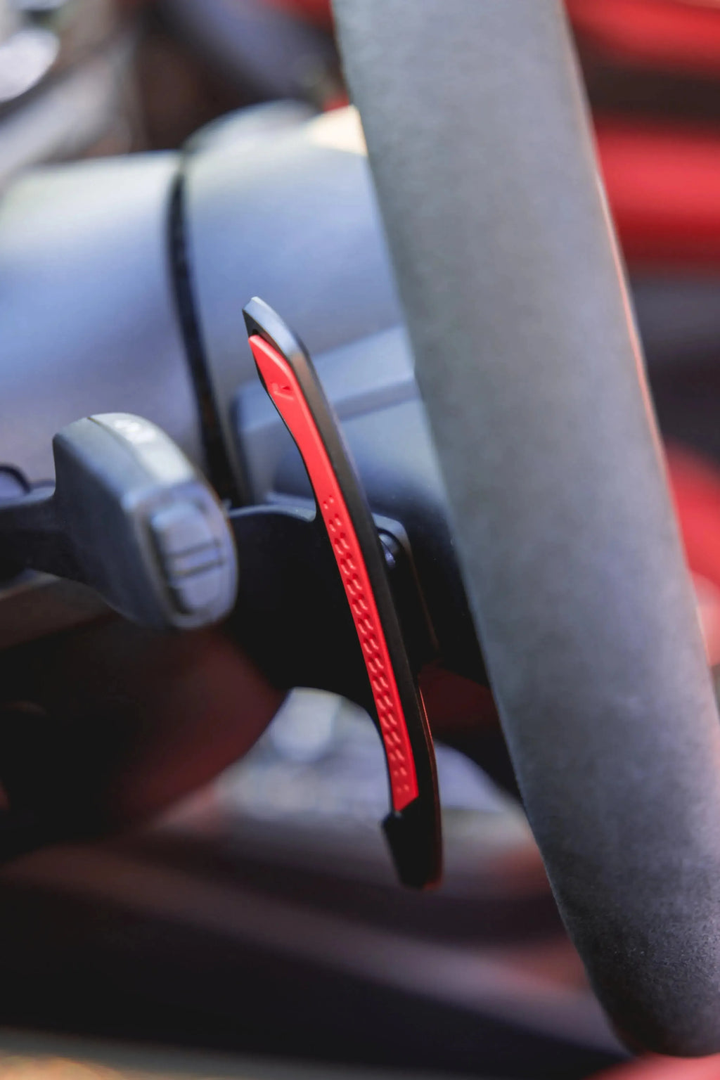 Installed carbon paddle shifter with red edge, side close-up (MP Style) – BMW G87 M2 / G80 M3 / G82 M4