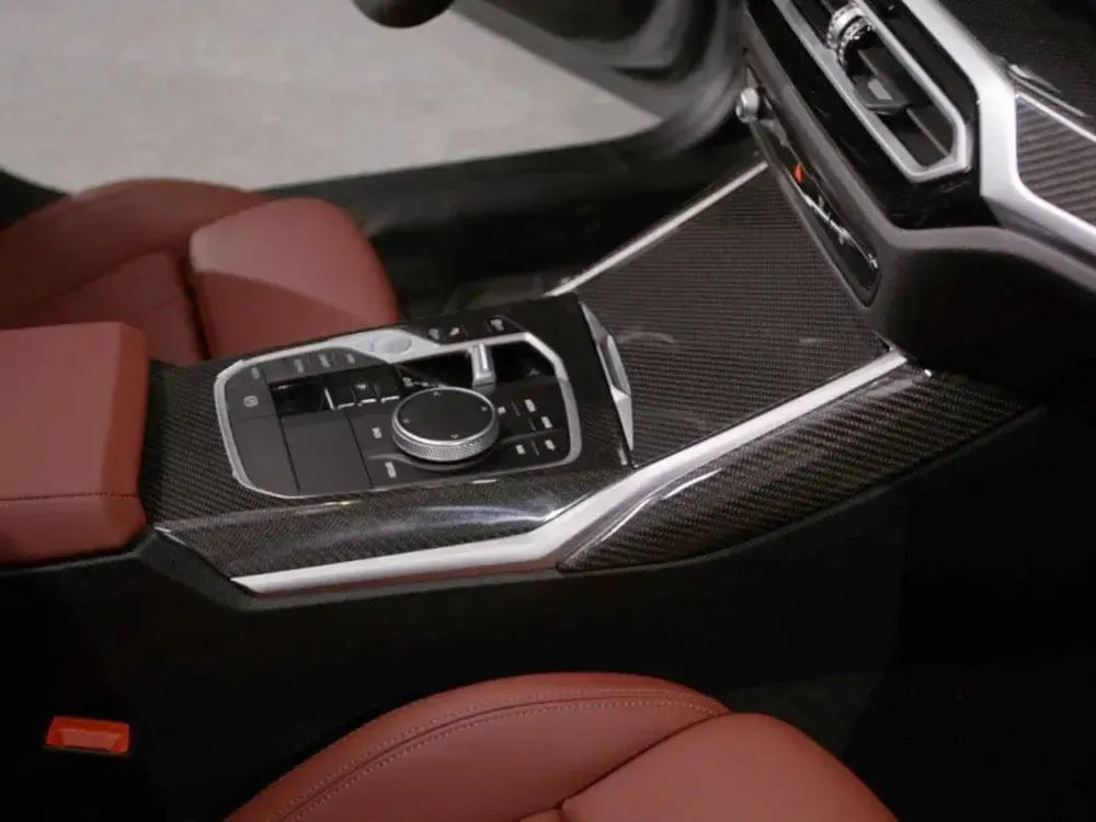 BMW G20 LCI center console with gloss carbon trim, light brown leather seats