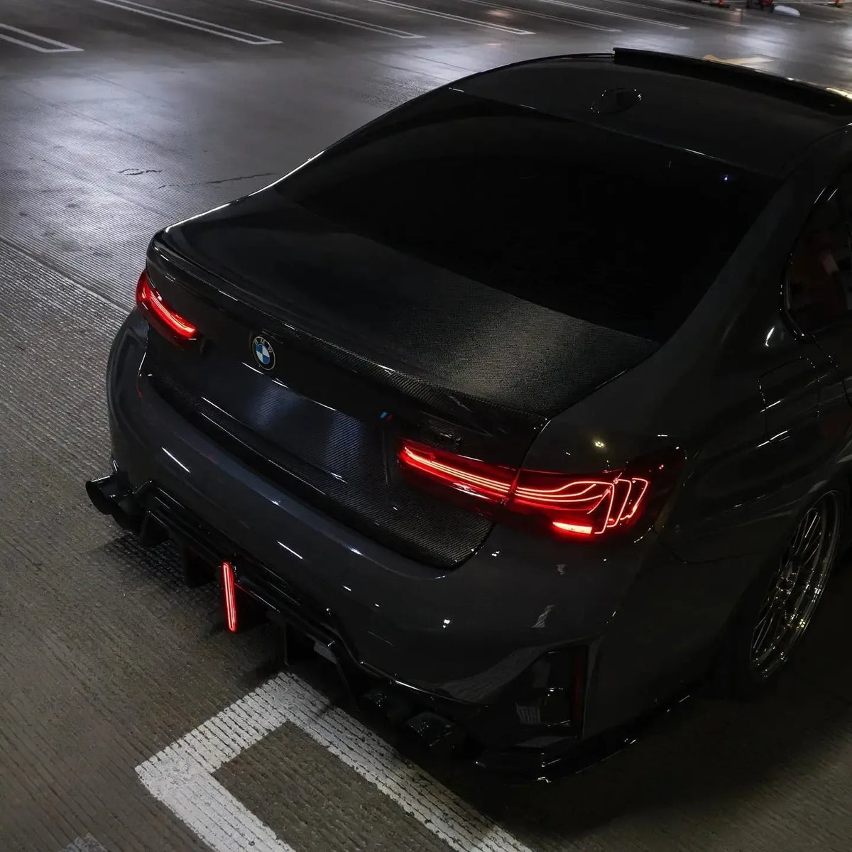Dark BMW G20 rear from above at night, with carbon ducktail trunk lid (CSL Style)