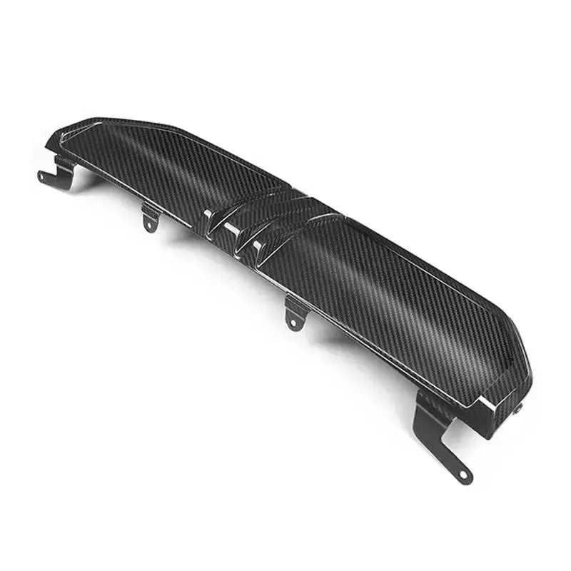 Carbon rear diffuser center section with mounting brackets, three-quarter view (Euro Style) – BMW G20 3 Series