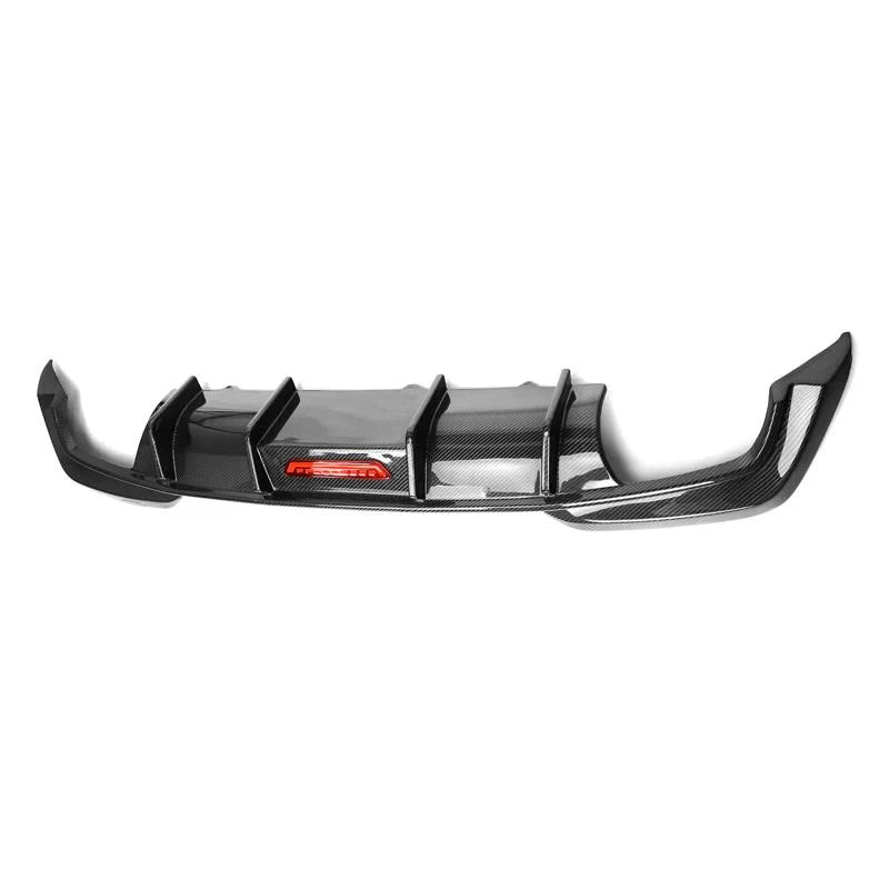 Four-fin carbon rear diffuser with red LED brake light, angled view (TK Style LED) – BMW G20 3 Series