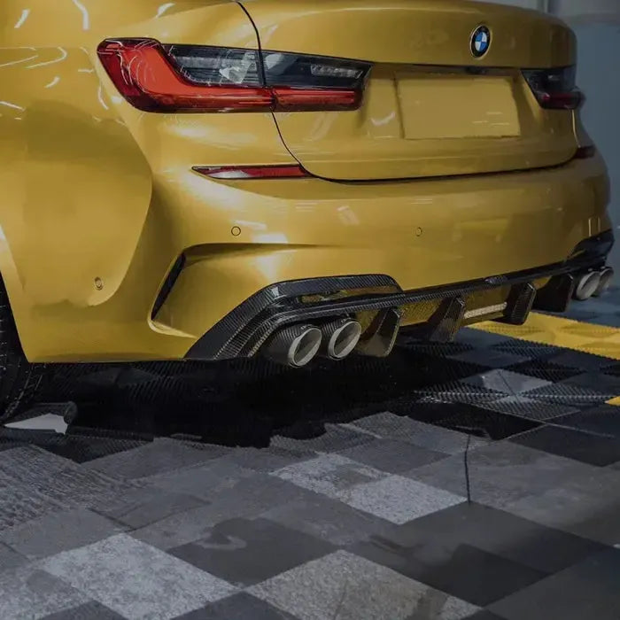 Yellow BMW G20 rear close-up, three-quarter view, with carbon diffuser and four exhaust tips (TK Style)