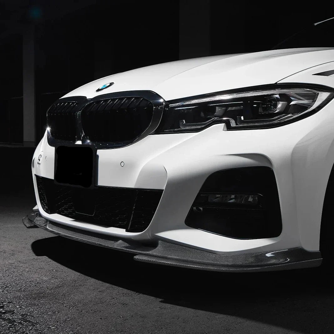 White BMW G20 M Sport front three-quarter close-up in a dark studio, with carbon front lip (3D Style)