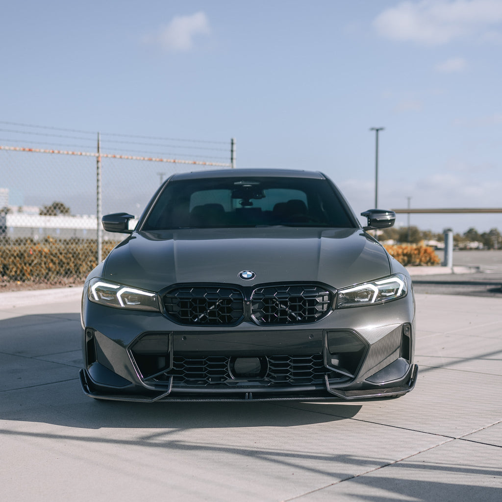 Gray BMW G20 LCI head-on, fitted with carbon front lip with corner splitters (AD Style)