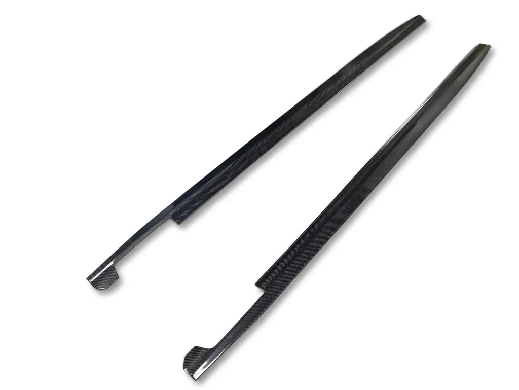 Carbon fiber side skirt pair at an angle, on a white background (CMST Style) – BMW G20 3 Series