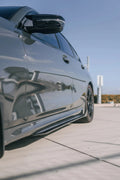 Close-up of a gray BMW G20 side with fitted carbon side skirt (TK Style)
