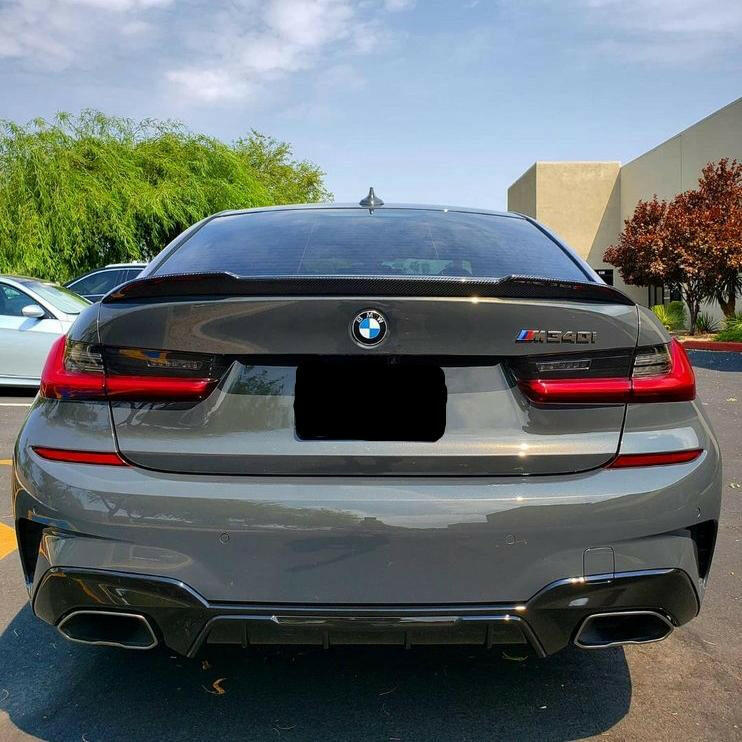 Gray BMW G20 M340i from the rear, with fitted carbon trunk spoiler (CS Style)