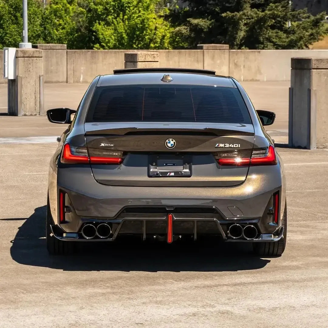 Bronze gray BMW G20 M340i LCI from the rear, with fitted carbon trunk spoiler (M4 Style)