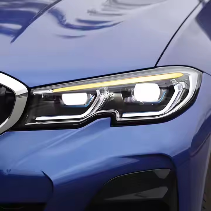Blue BMW G20 headlight: white DRL, amber strip, low beam on (Dual-Color Laser Style)