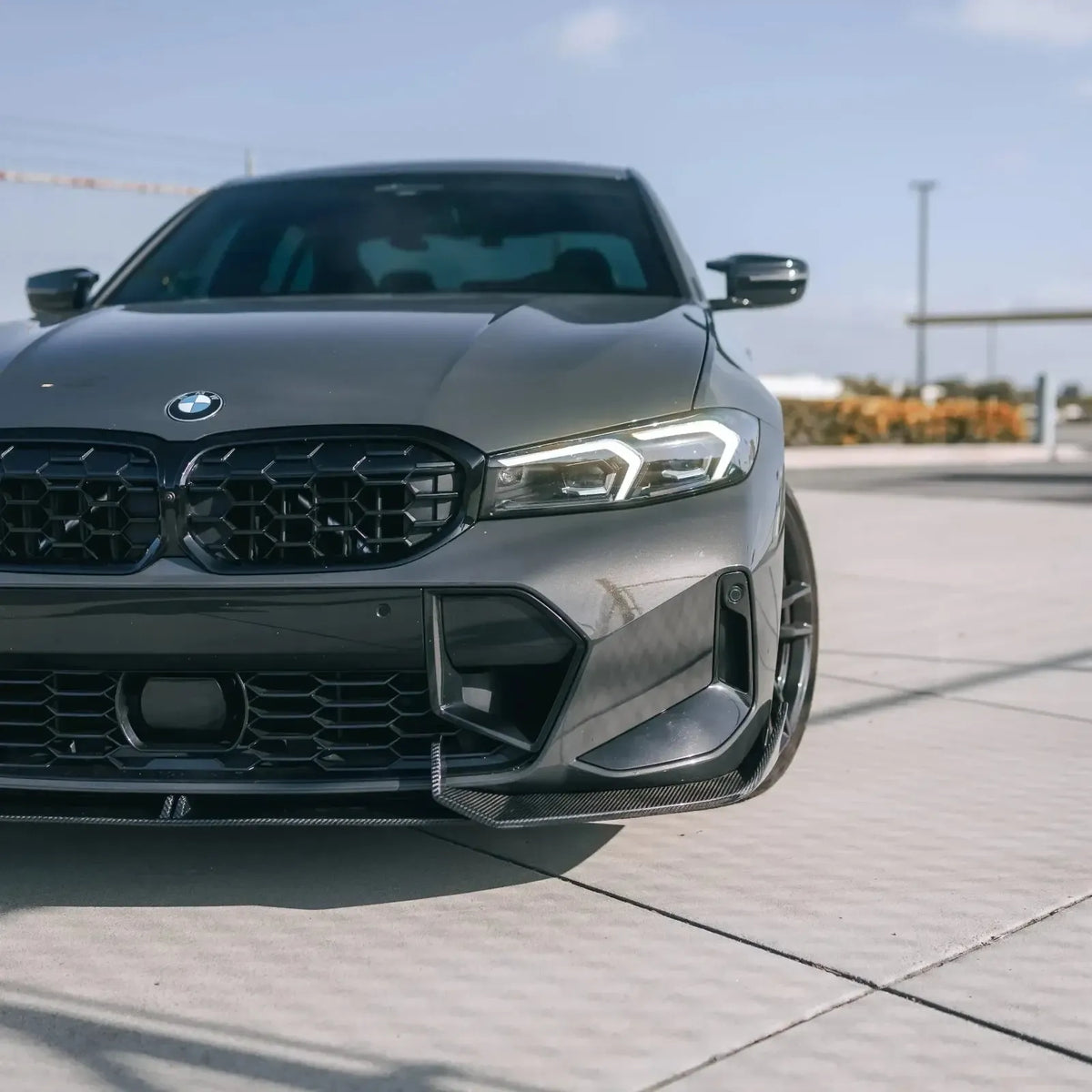 Close-up of the front of a gray BMW G20 LCI, LED headlight with white daytime running light (LCI Style)