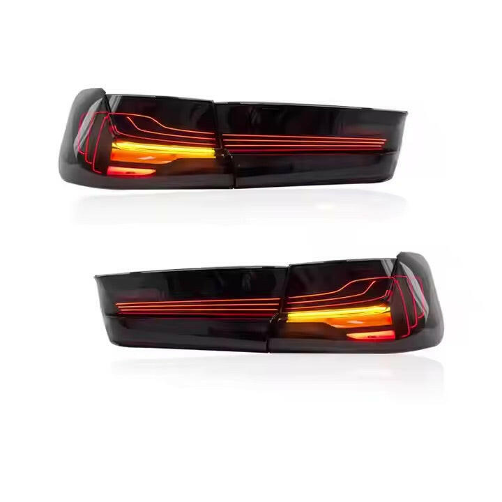 Two smoked tail light sets, red and yellow lights on (CSL Style V1) – BMW G20 3 Series
