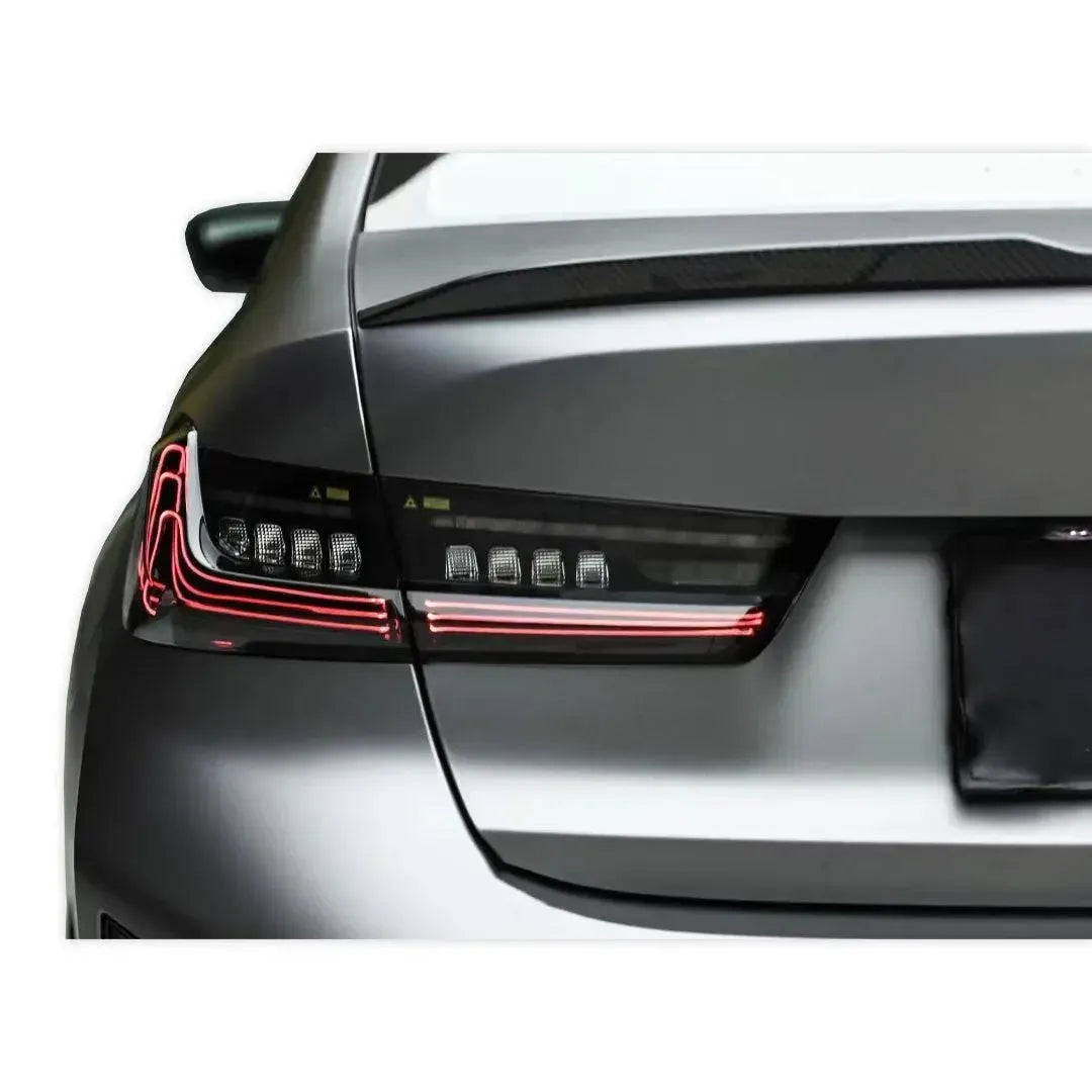 Matte gray BMW G20 rear, close-up of the left smoked laser tail light (CSL Style V2)