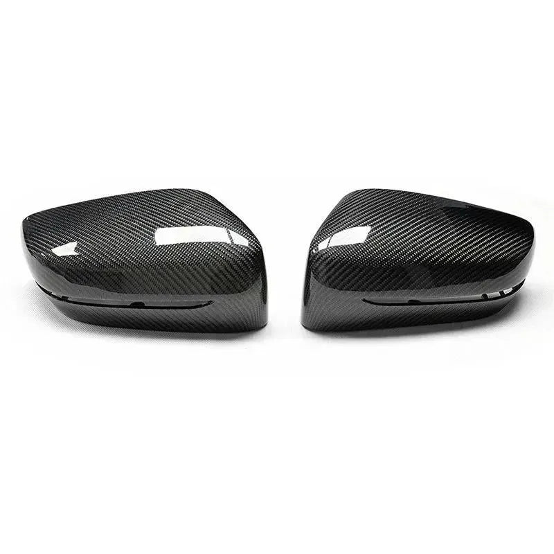 Carbon mirror cap pair on a white background, front three-quarter view (OEM Style) – BMW G20 3 Series