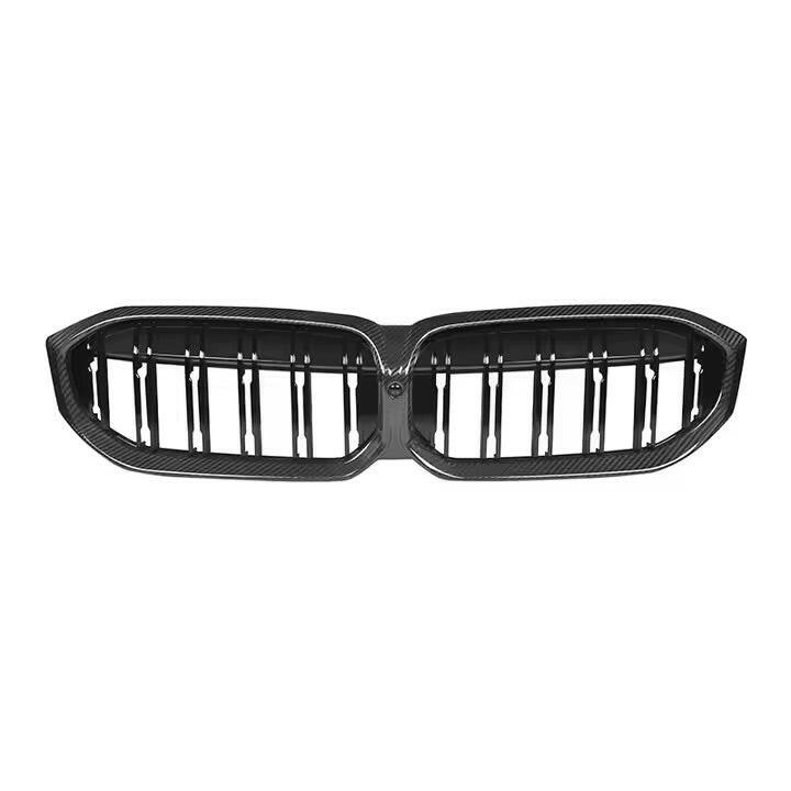 Carbon-framed double-slat kidney grille, front view, on a white background – BMW G20 3 Series