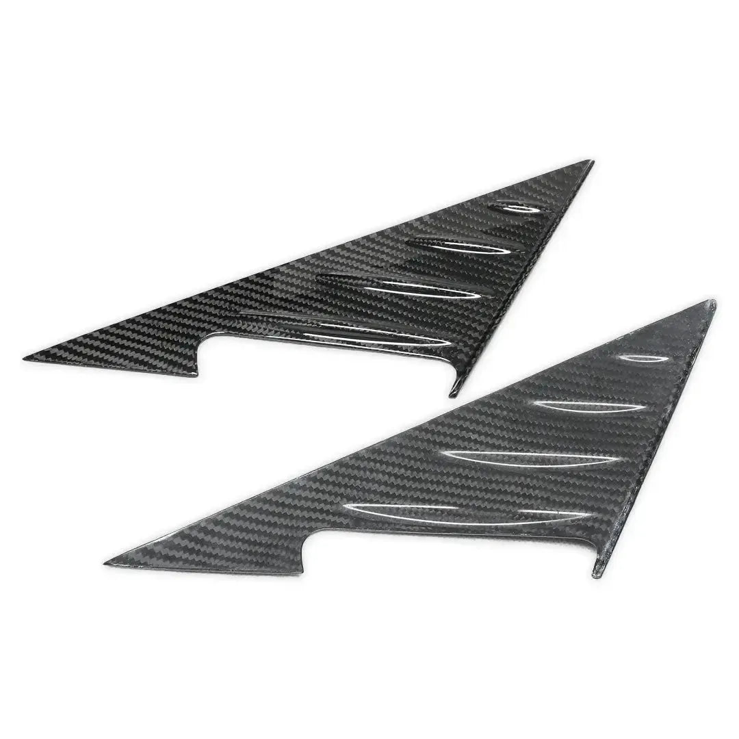 Carbon fiber A-pillar cover pair side by side, angled view – BMW G87 M2 / G42