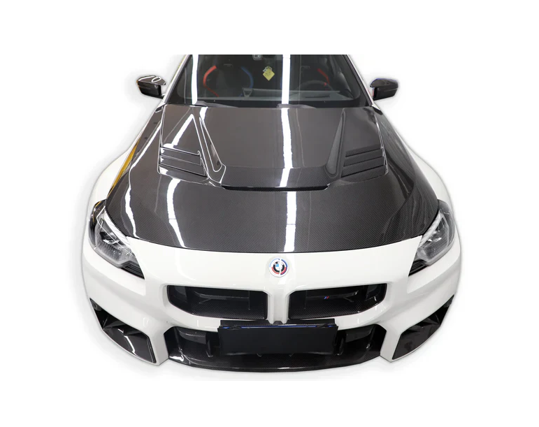 White BMW G87 M2 from the front, with fitted PM V1 Style vented carbon hood