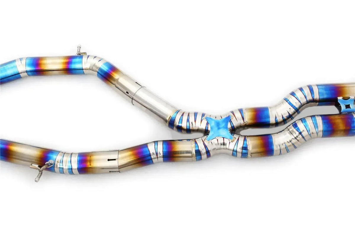 Titanium X-pipe section with blue-burnt welds, close-up – BMW F80 M3 / F82 M4