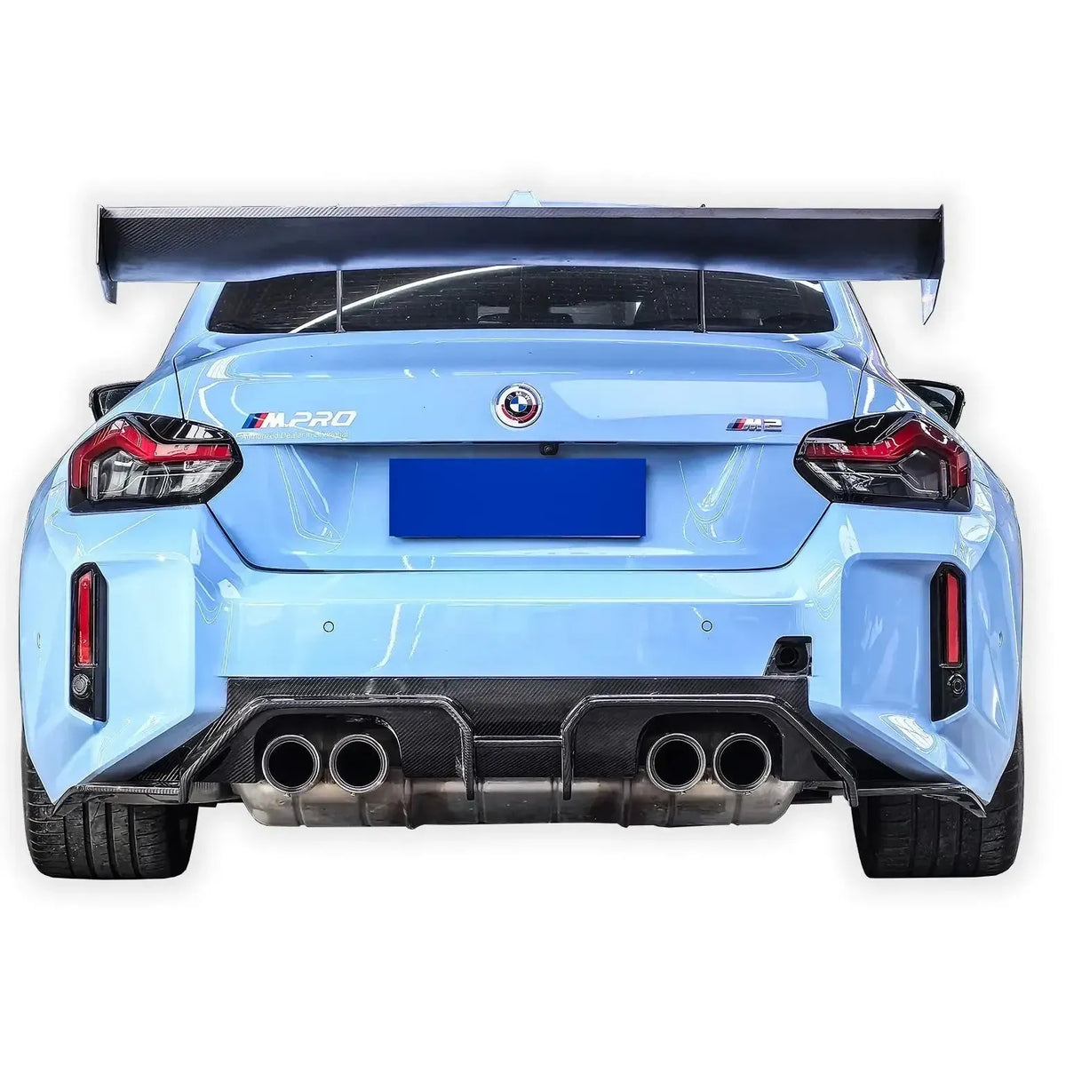 Rear of a light blue BMW G87 M2 with carbon fiber rear diffuser (Signature V2 Style)