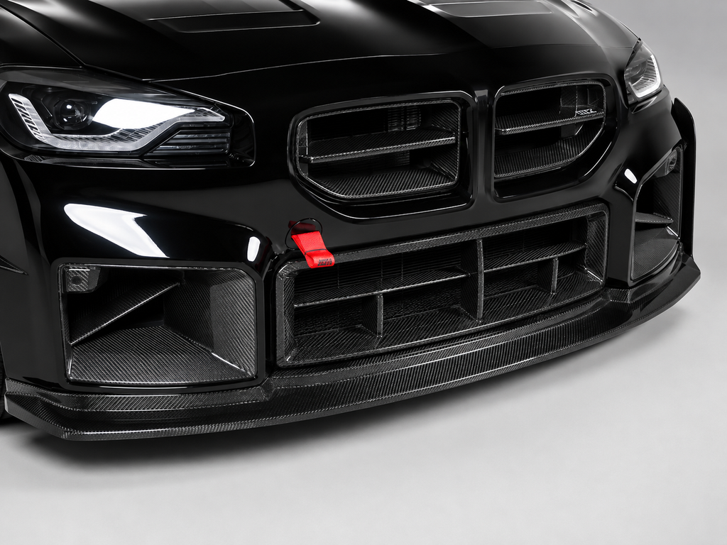 Carbon fiber front lip close-up on a black BMW G87 M2 (GT Style)