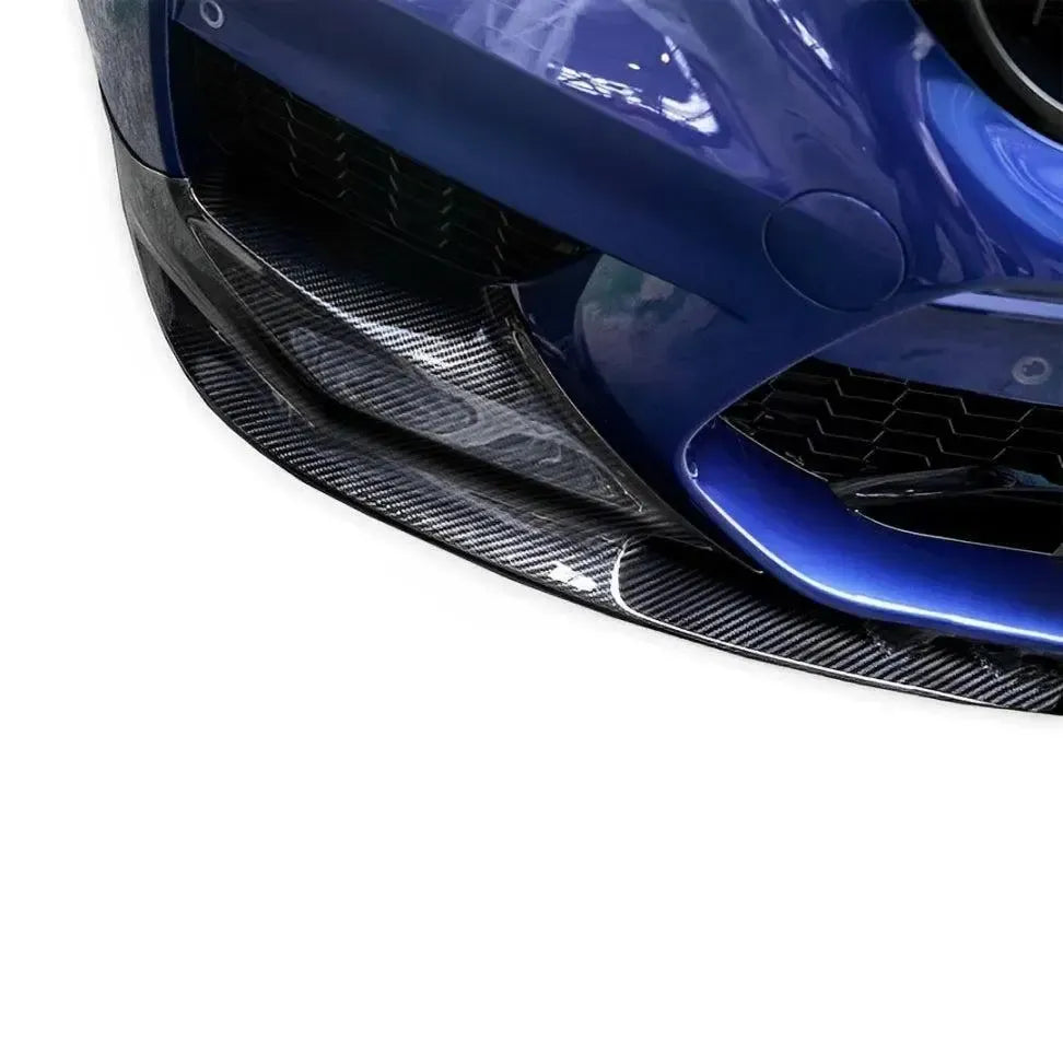 Close-up of a blue BMW F90 M5 front corner with fitted winglet carbon front lip (3D Style)
