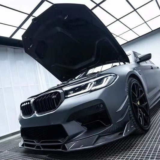 Gray BMW F90 M5 LCI with open hood, carbon center lip and front aero parts