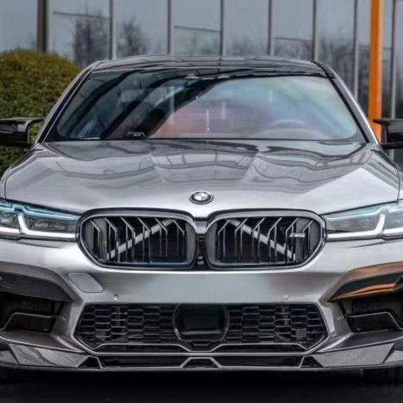 Silver BMW F90 M5 LCI head-on, with carbon center lip below the center air intake