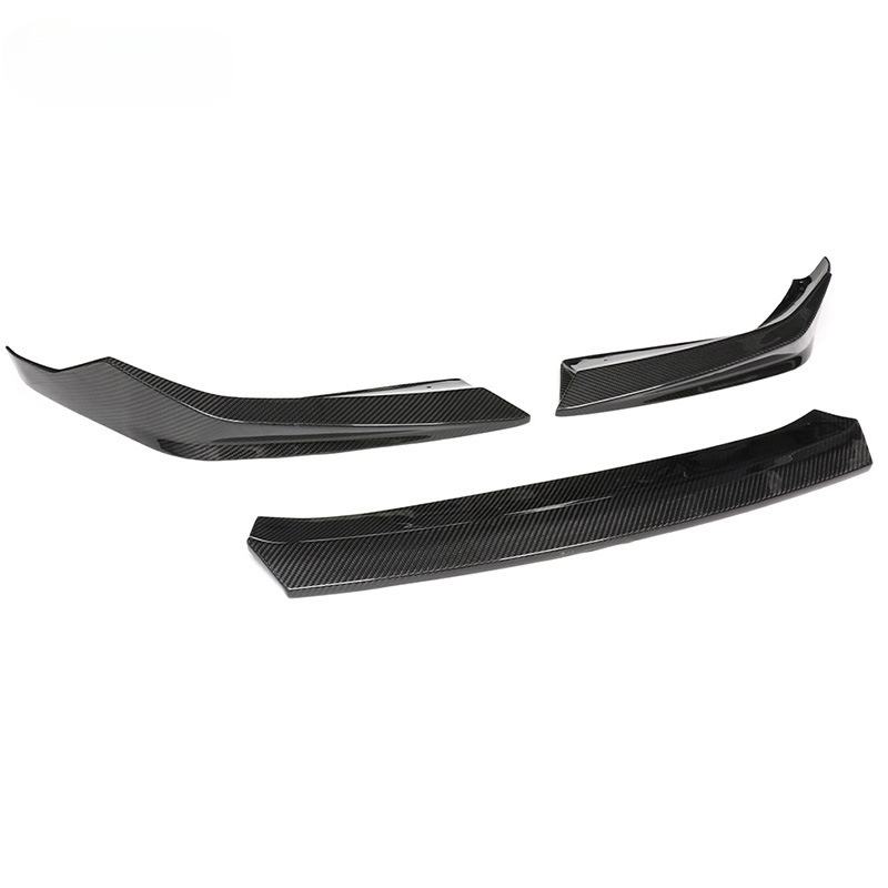Three-piece carbon front lip photographed at an angle (PM Style) – BMW F90 M5