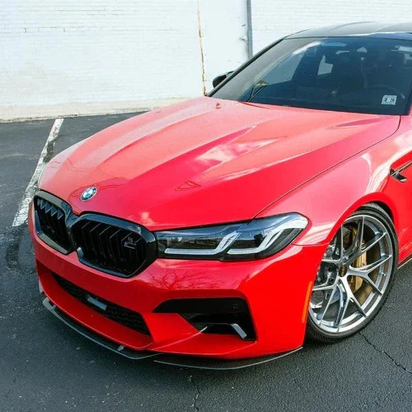Red BMW F90 M5 LCI front three-quarter shot with carbon front lip (ST Style)
