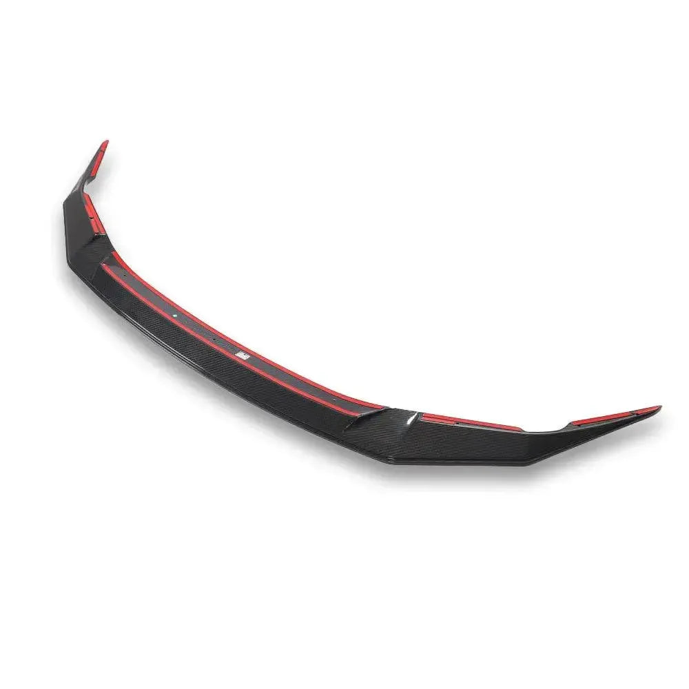 Carbon fiber front lip, angled three-quarter view, on a white background (V Style) – BMW F90 M5