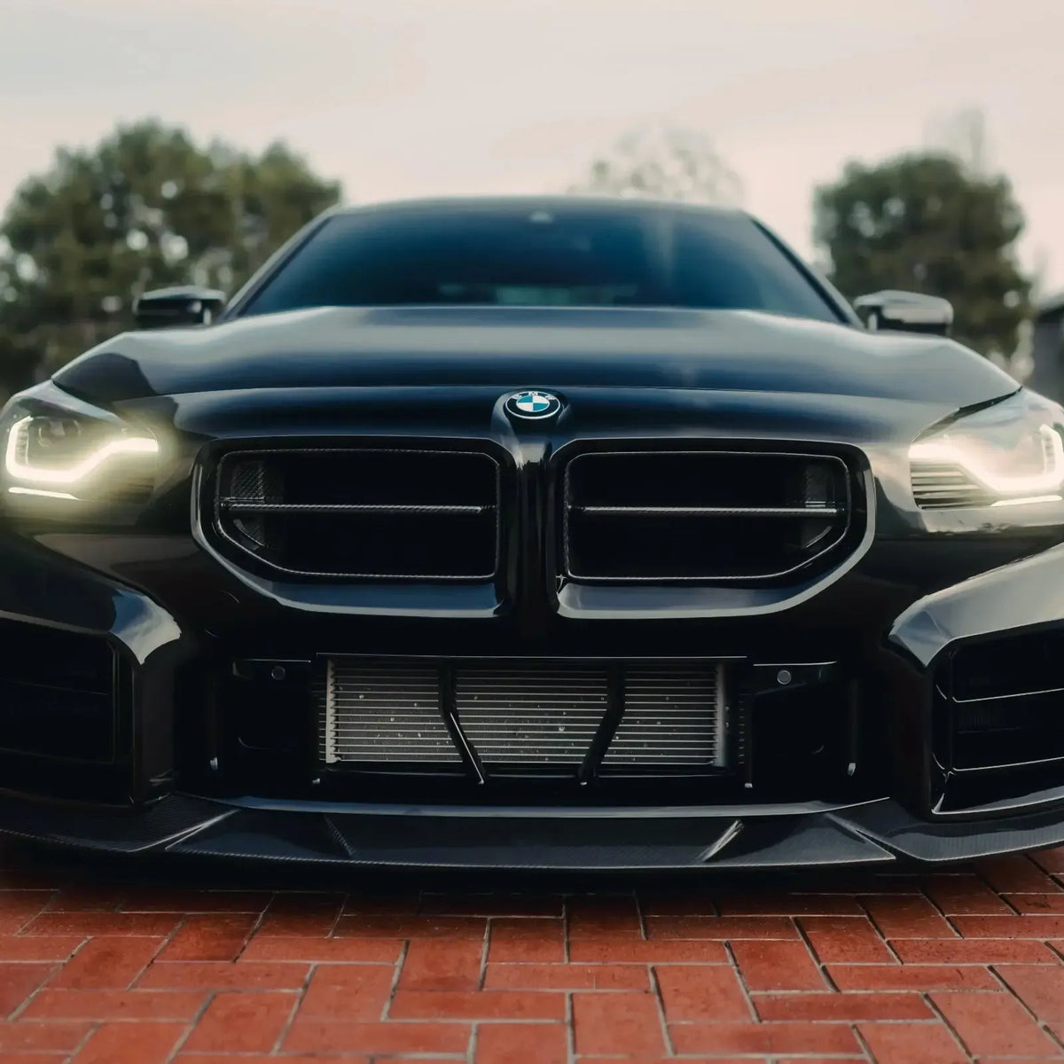 Black BMW G87 M2 with carbon fiber front kidney grilles (AN Style)