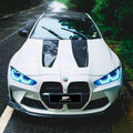 Fehér bmw m4 fekete versenysávokkal és kék led fényszórókkal géptető carbon fiber bmw g80 g81 m3 kipufogó rendszerhez