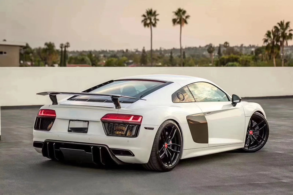 White pre-facelift Audi R8 4S Coupé, rear three-quarter view with fitted carbon diffuser and wing (VRS Style)